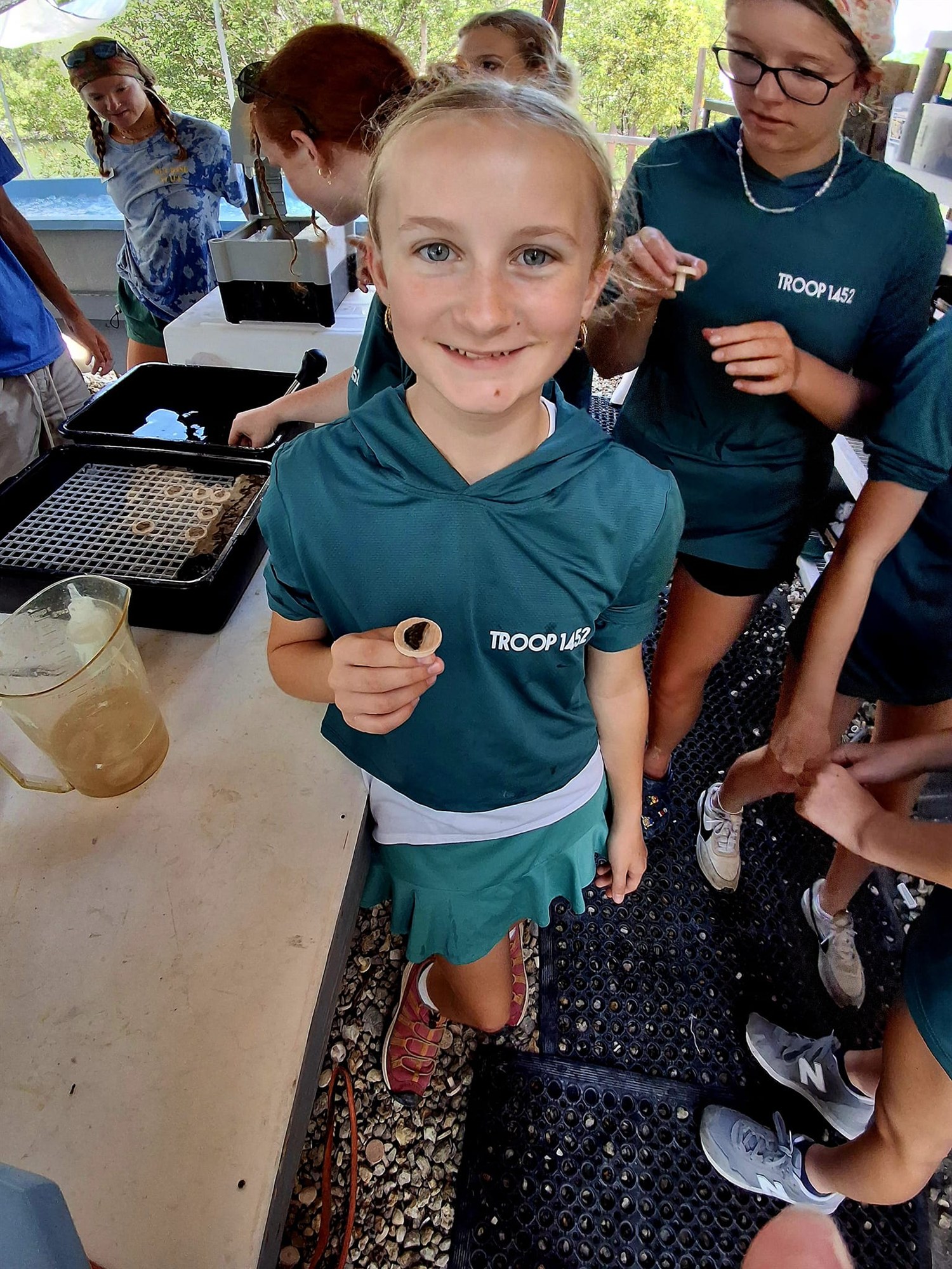 Lucy examining coral during the Marine STEM Adventure